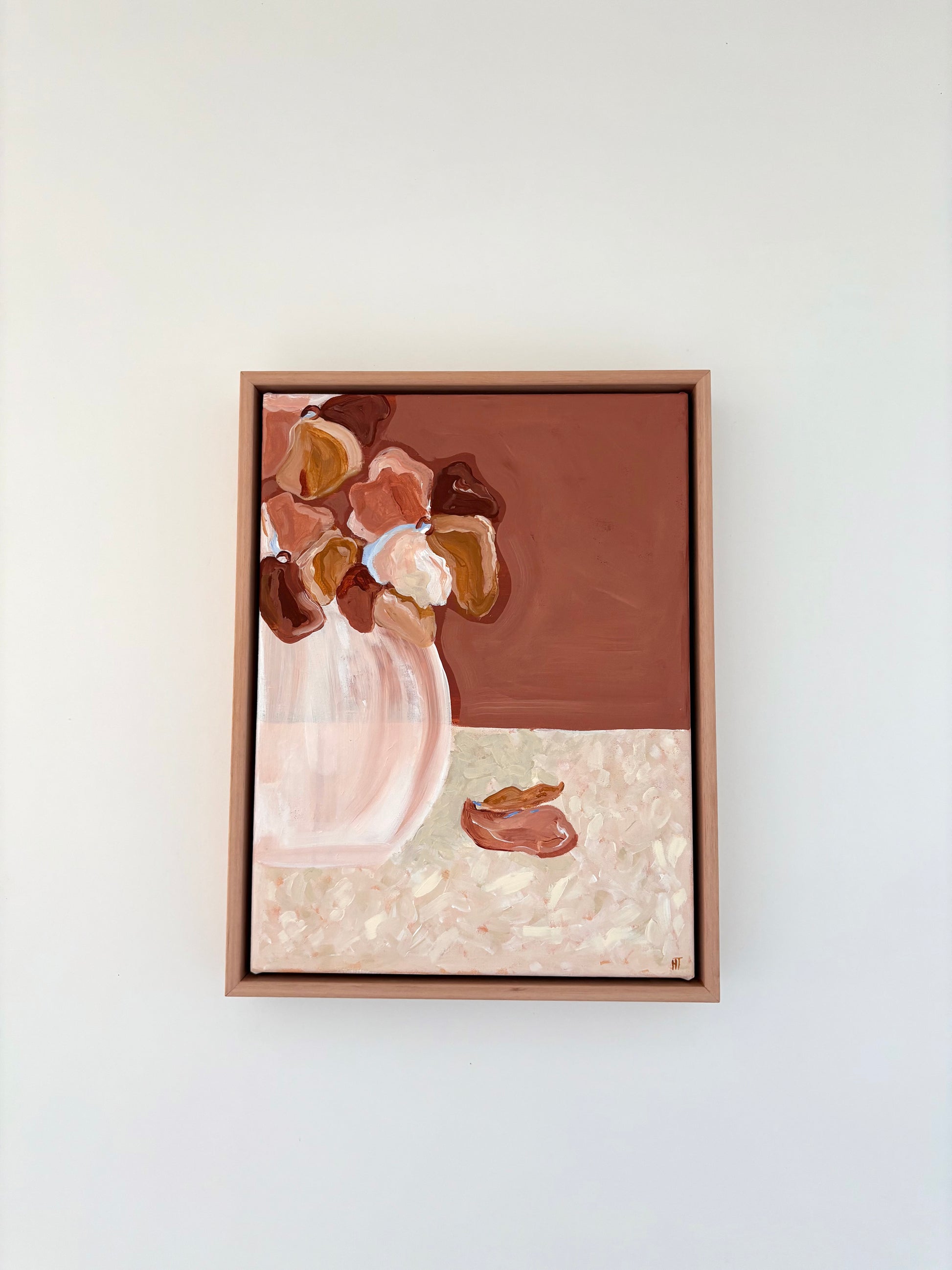 Abstract painting of warm brown and pink flowers in a vase on a brown and cream background. The bottom halve of the background is textured cream colours with two fallen petals. 