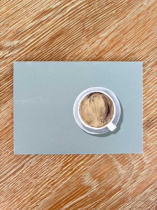 Painting of a coffee in a cup on a saucer with a muted teal  background