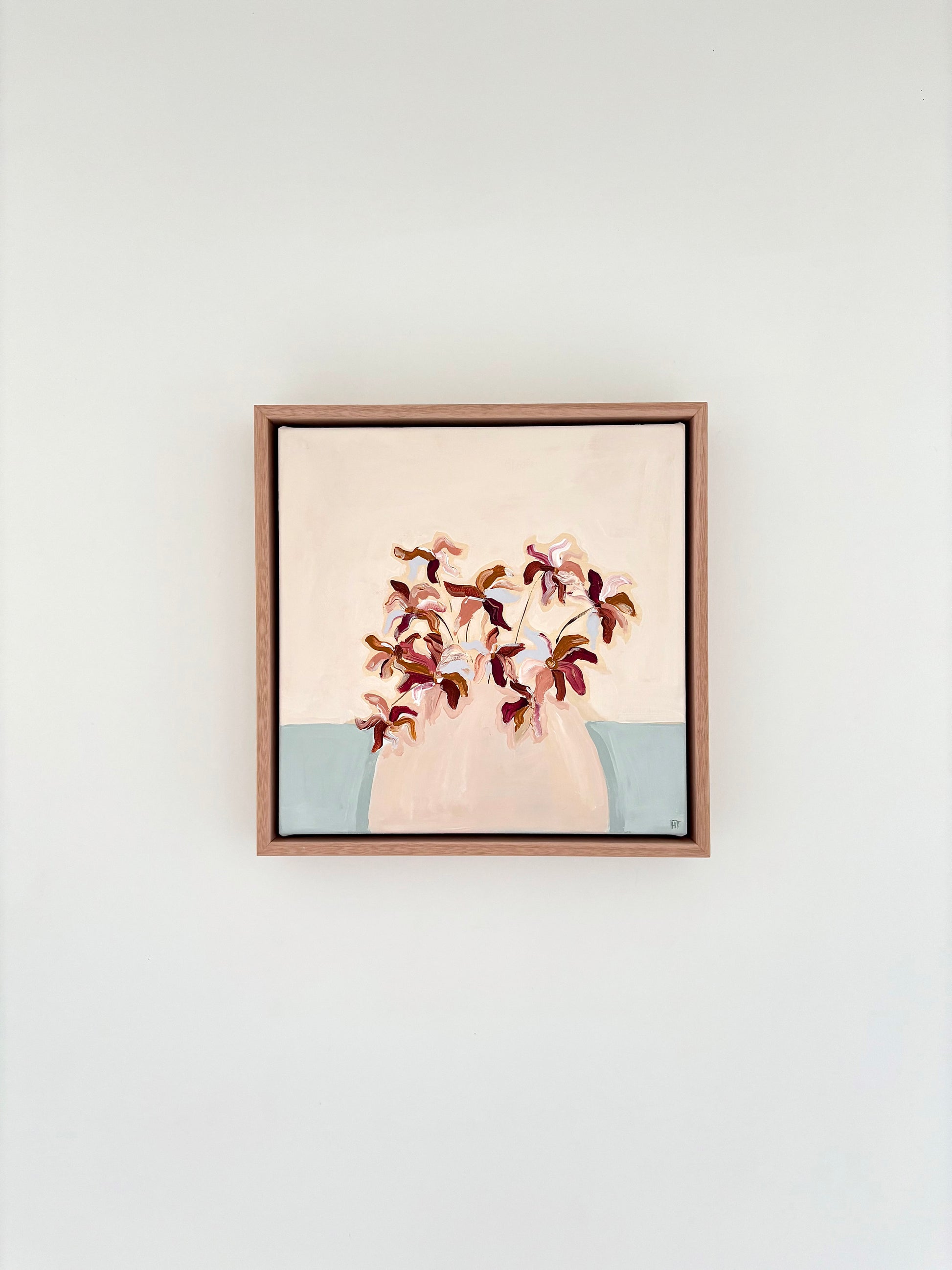 Painting of burgundy brown and blue abstract flowers in a pale pink vase with a cream and pale blue background. 