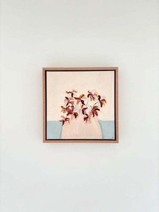 Painting of burgundy brown and blue abstract flowers in a pale pink vase with a cream and pale blue background. 
